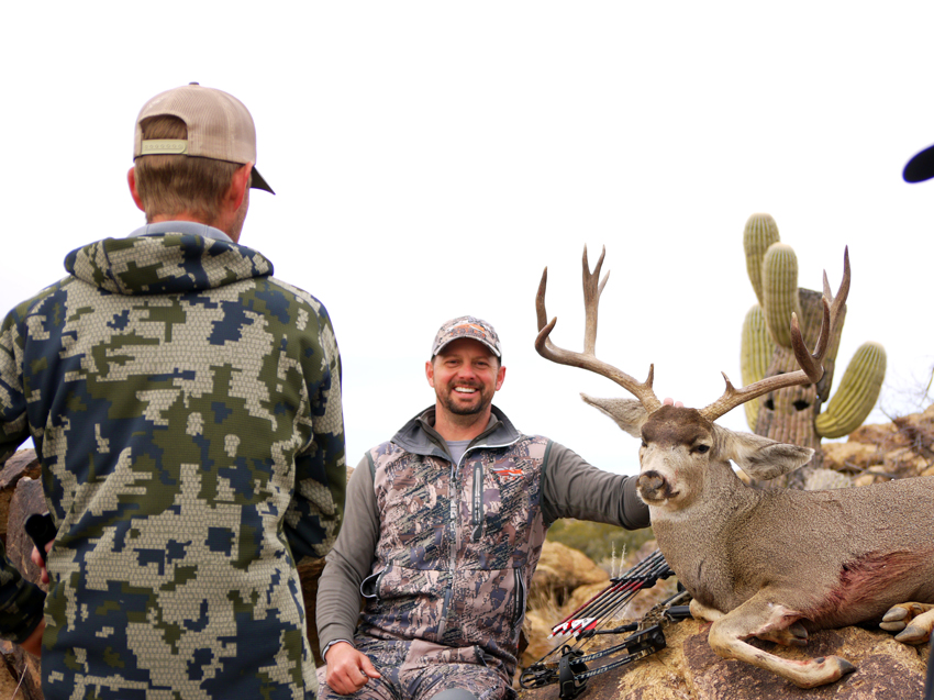 All smiles after taking a big old Arizona Archery Mule Deer with Exclusive Pursuit Outfitters.