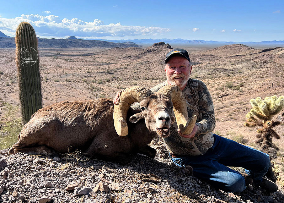 Red holding his old 41E trophy desert bighorn.